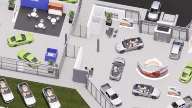 Luftfoto af en moderne bilforhandler med biler parkeret inde og ude, skriveborde, siddepladser og udstillingsstande.